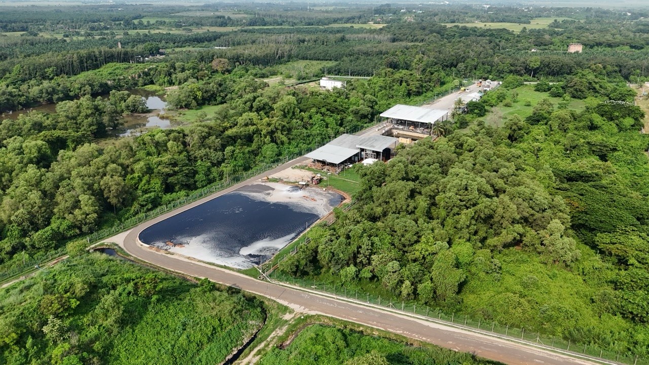 Aerial view of infrastructure set within a green Malaysian landscape